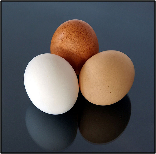 three eggs of different colors